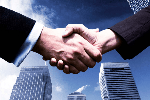 Hands shaking for real estate deal done