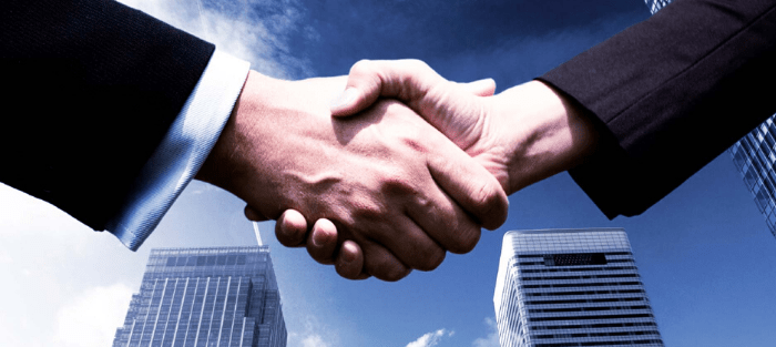 Hands shaking for real estate deal done
