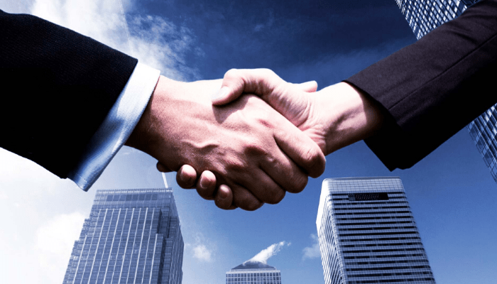 Hands shaking for real estate deal done